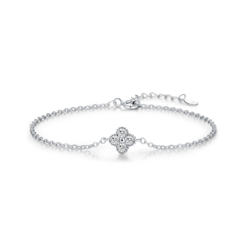 Silver bracelet with a clover-shaped clasp on a white background