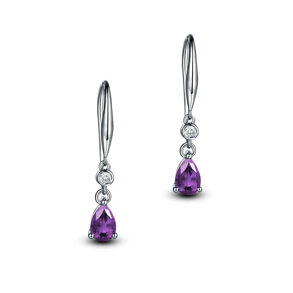 Pair of silver earrings with purple gemstones on a white background