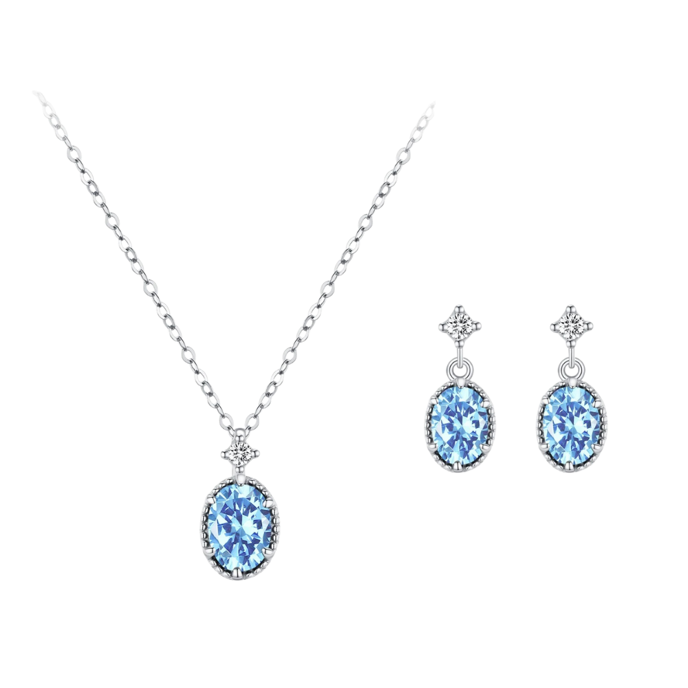 Jewelry set with blue gemstones on a white background